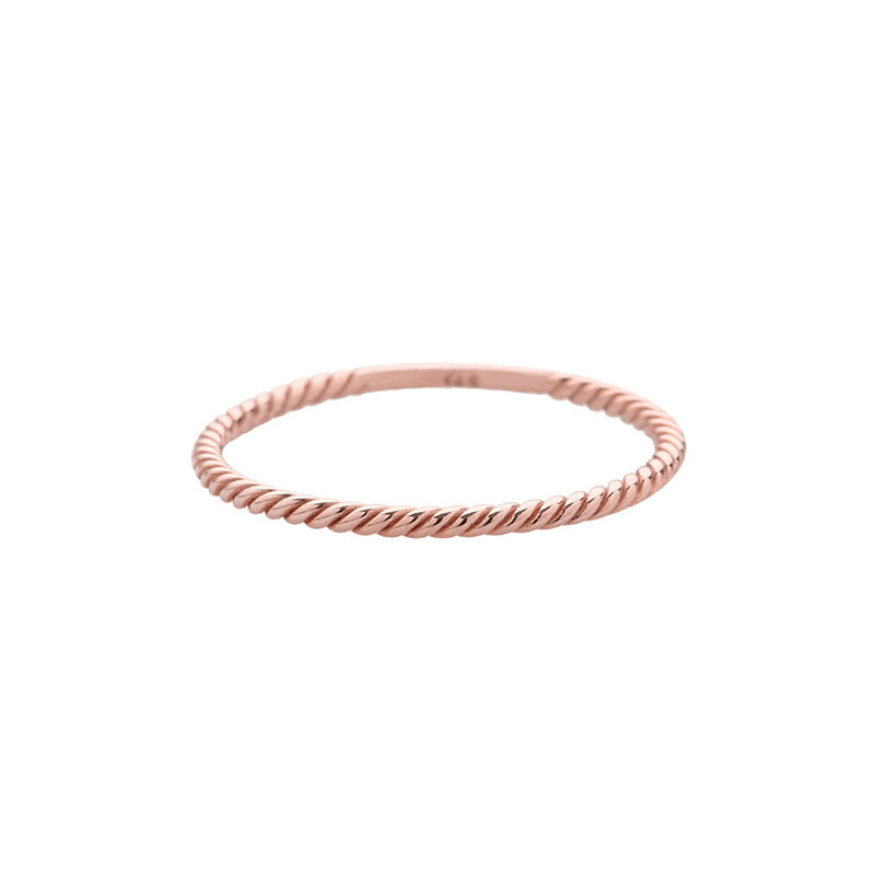 twisted staker ring made from solid 14k rose gold