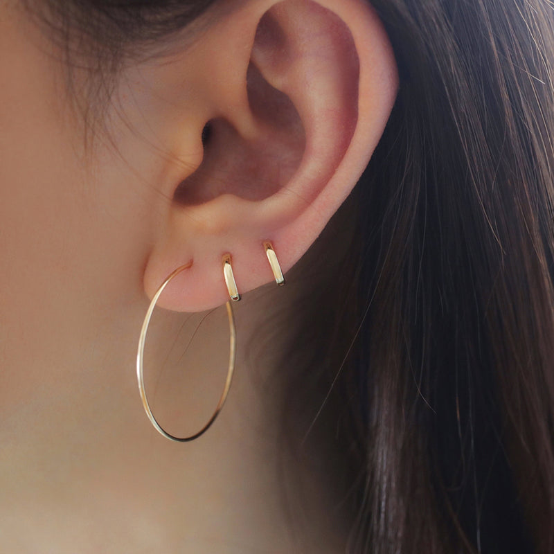 tiny 6mm hugging hoop earrings in second and third hole piercings