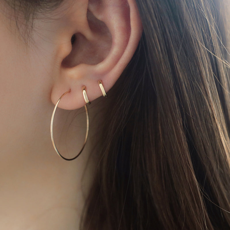 tiny 6mm huggie hoop earrings made from 14k gold