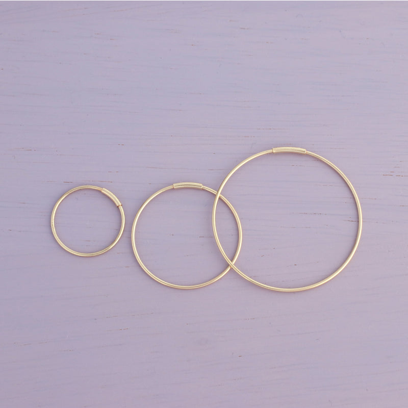 14k gold endless hoops in small, medium and large