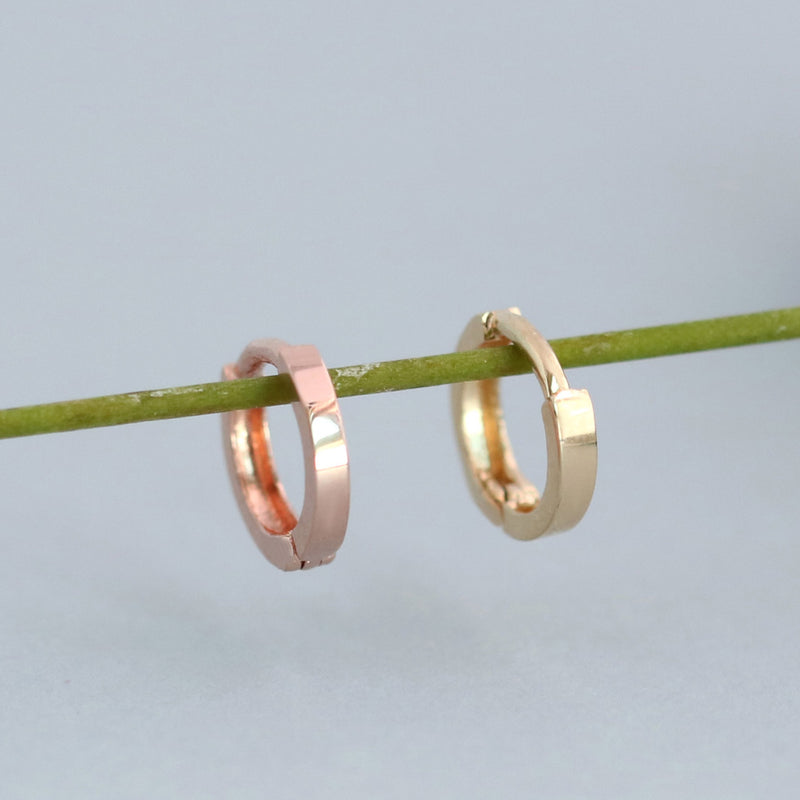 tiny flat huggie hoop in 14k yellow gold and rose gold