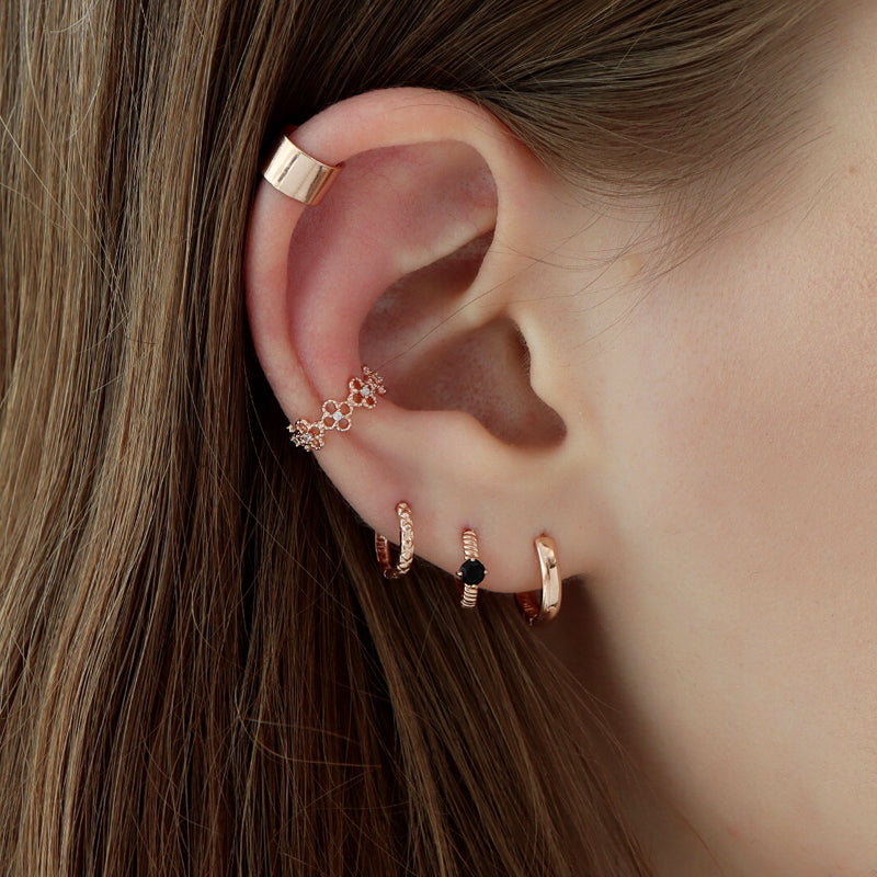 rose gold small hoop earrings in multiple piercings