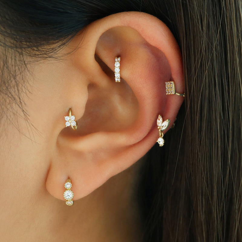 clover huggie hoop earring in tragus piercing