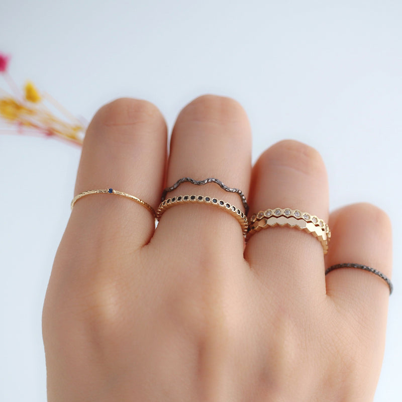 gold and black stacking rings