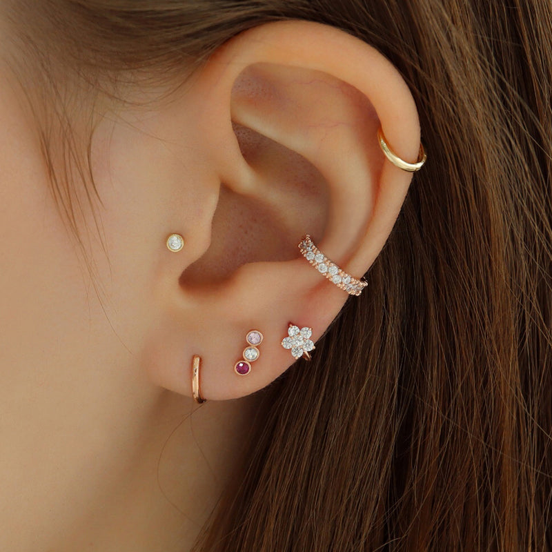 small huggie hoop earring in upper lobe piercing