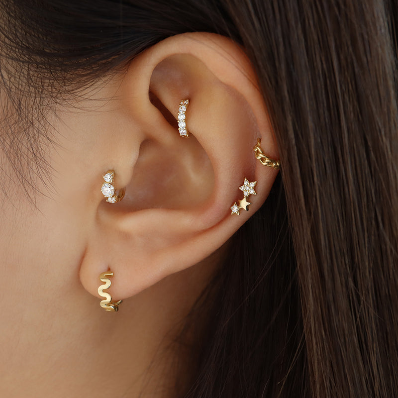 triple diamond hoop earring in tragus piercing