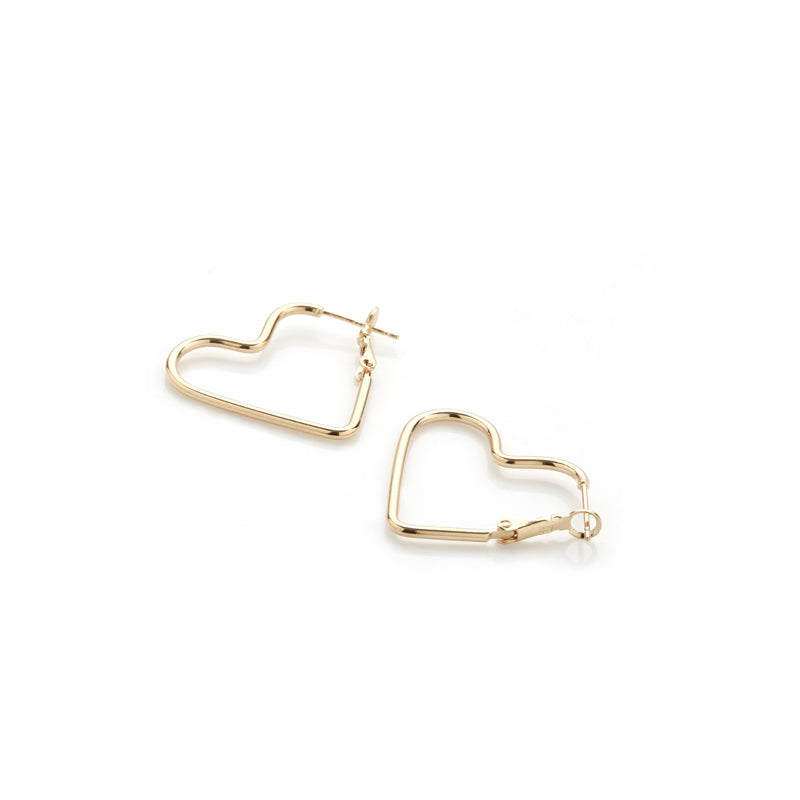 a pair of gold heart hoop earrings