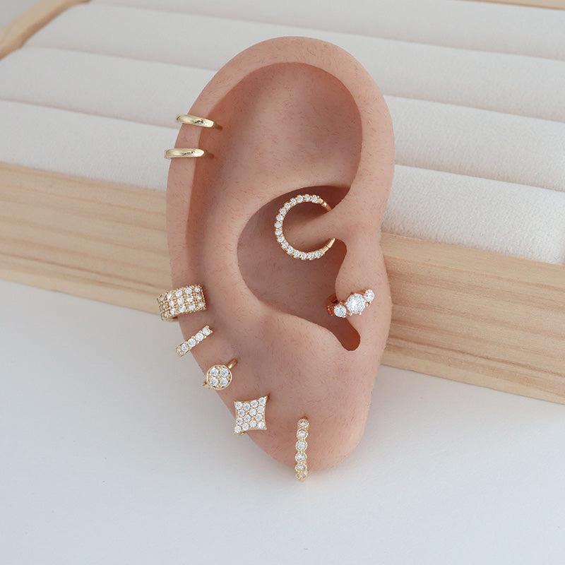 ear stack featuring tiny huggie hoops 