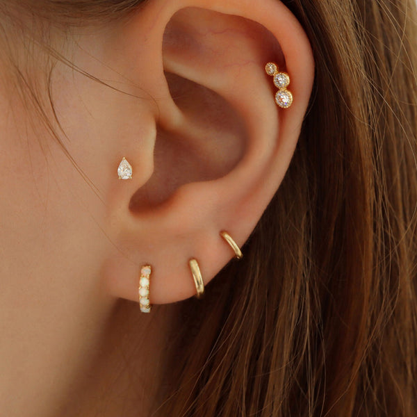 small huggie hoop earring in second lobe piercing