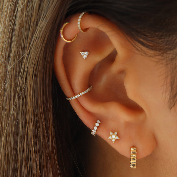 tiny diamond pave huggie hoop earring in third lobe piercing