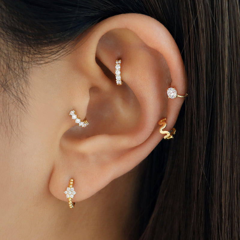 tiny diamond huggie hoop earring in tragus piercing